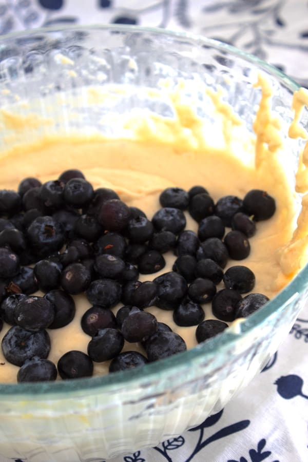 blueberry muffin batter in a clear bowl
