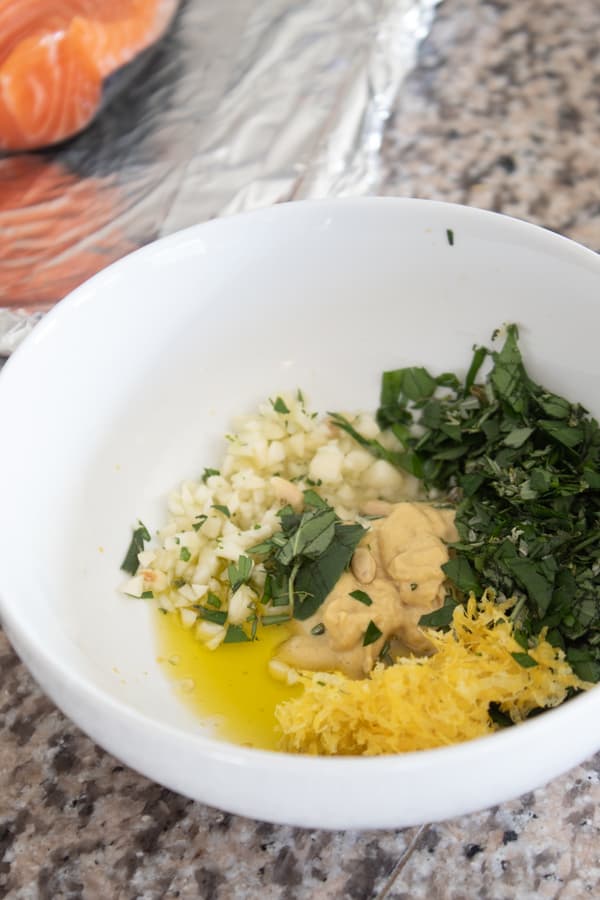 bowl of herbs garlic dijon and olive oil