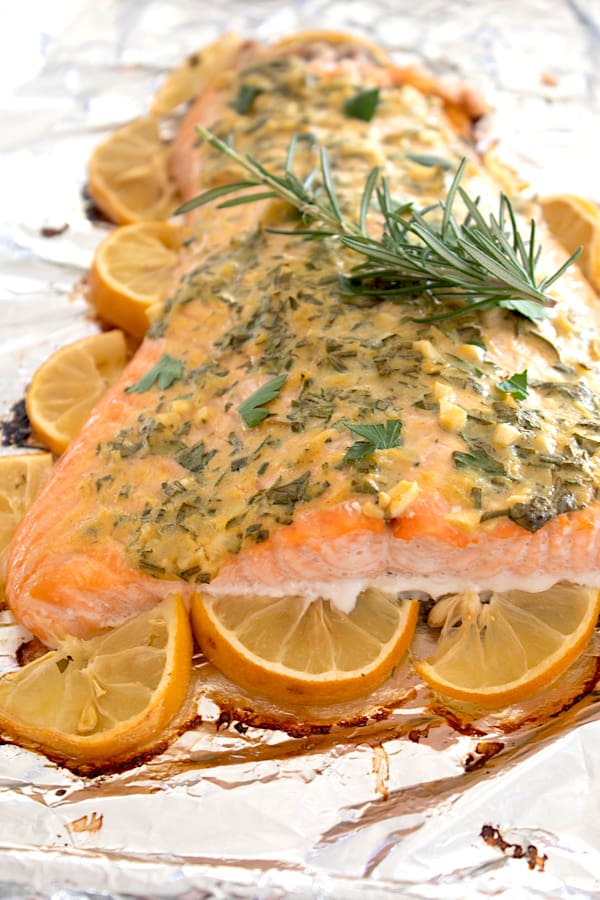 salmon lined with lemons and garlic herb topping