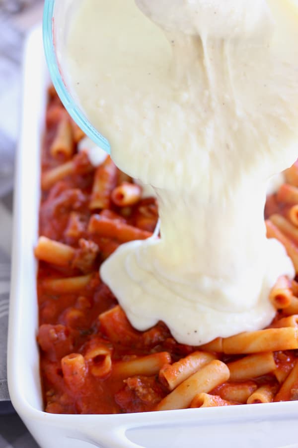 béchamel poured over sausage ziti