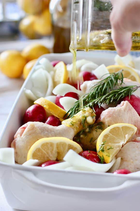 Easy marinade is poured over the chicken and potatoes before going in the oven