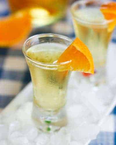 Orangecello in a liquor glass with a slice of orange