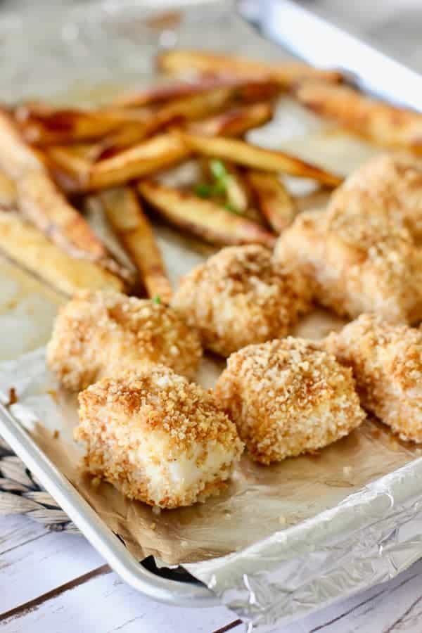 baked fish and chips on a sheet pan