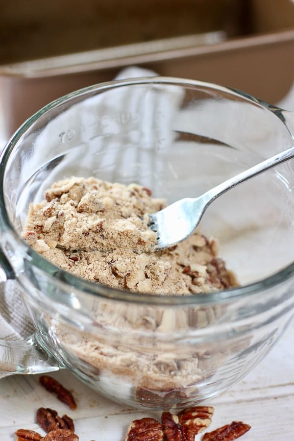 streusel for sour cream coffee cake in a clear bowl