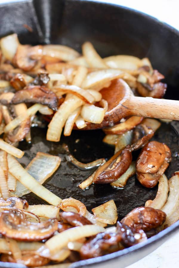 sauce mushroom and onions before adding beef patties to pan