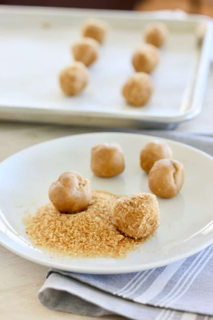 roll peanut butter cookies in turbinado sugar