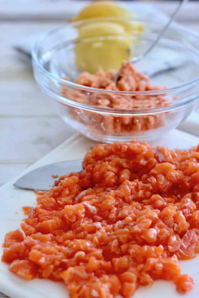 chopped salmon on cutting board