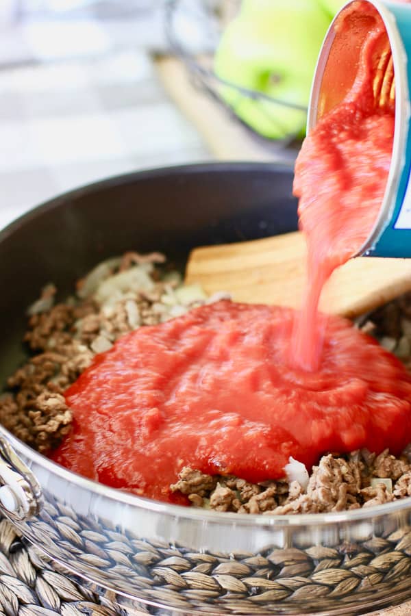 ground meat with tomato sauce in skillet