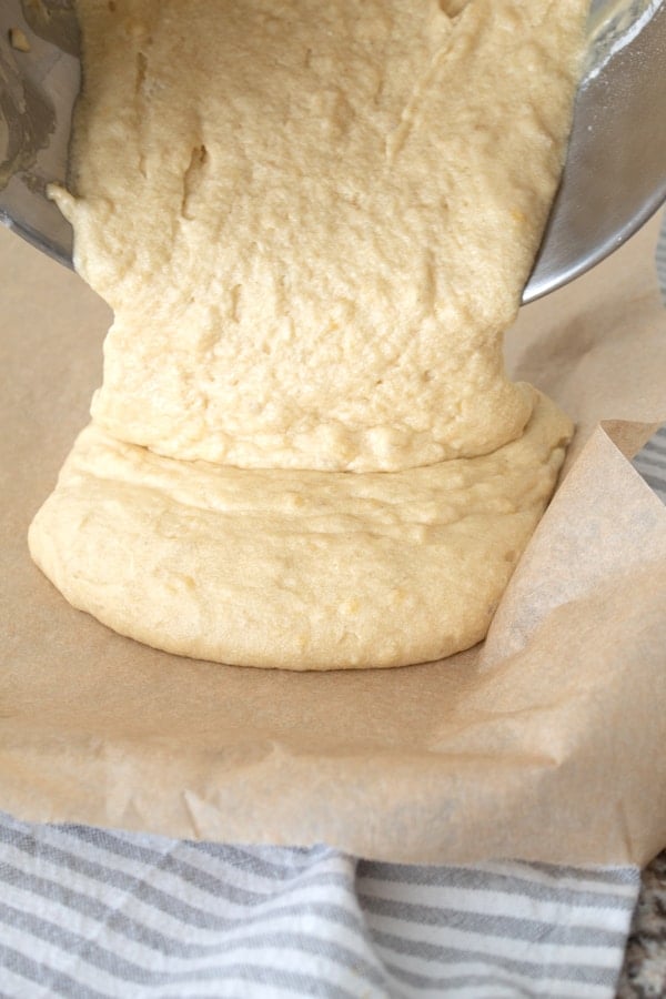 adding banana bar batter to sheet pan