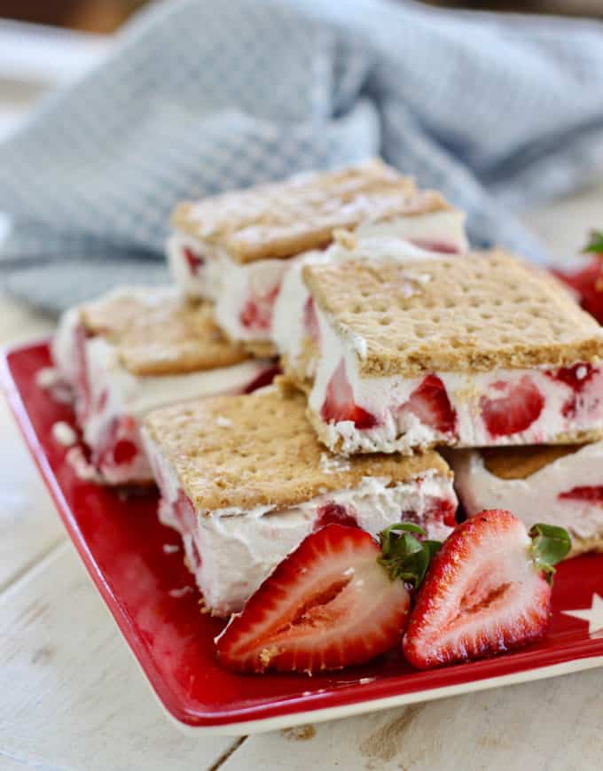 strawberry frozen yogurt treats on a red plate