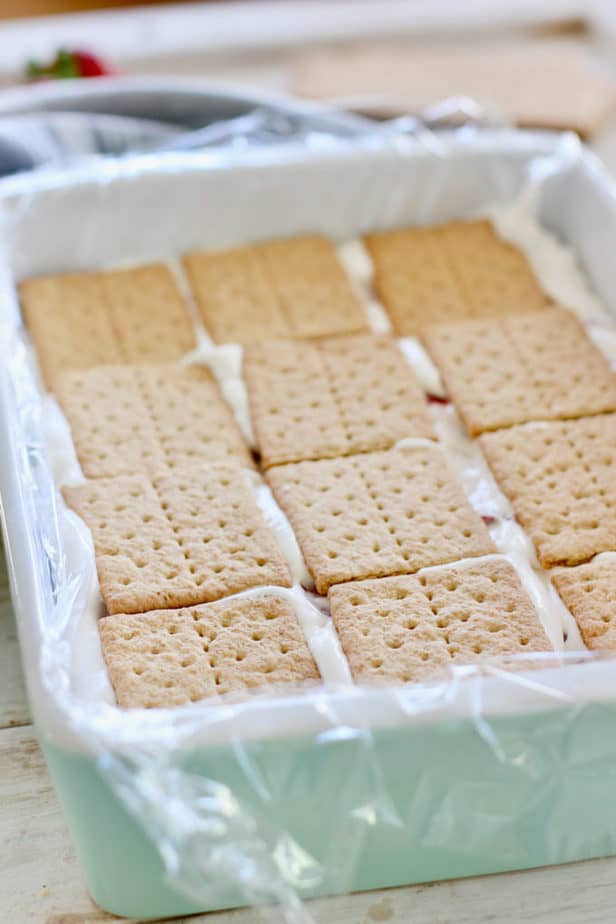 place graham crackers over whipped topping mixture