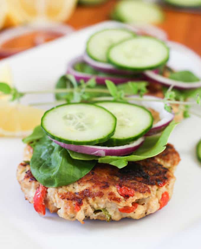 burgers topped with cucumber and spinach