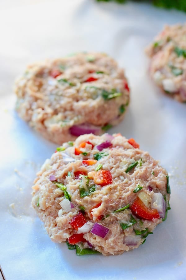 chicken burger patties on parchment paper