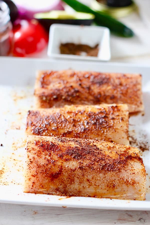 spice blend rubbed into mahi fish fillets