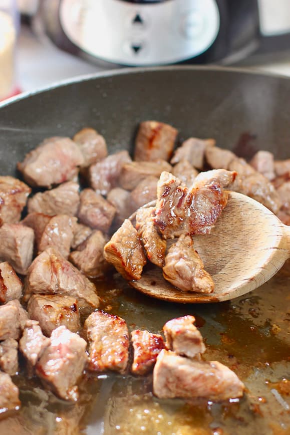 Browned stew meat in a large skillet
