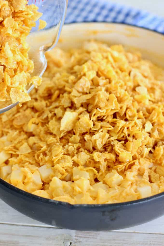 top the casserole with corn flake crumbs