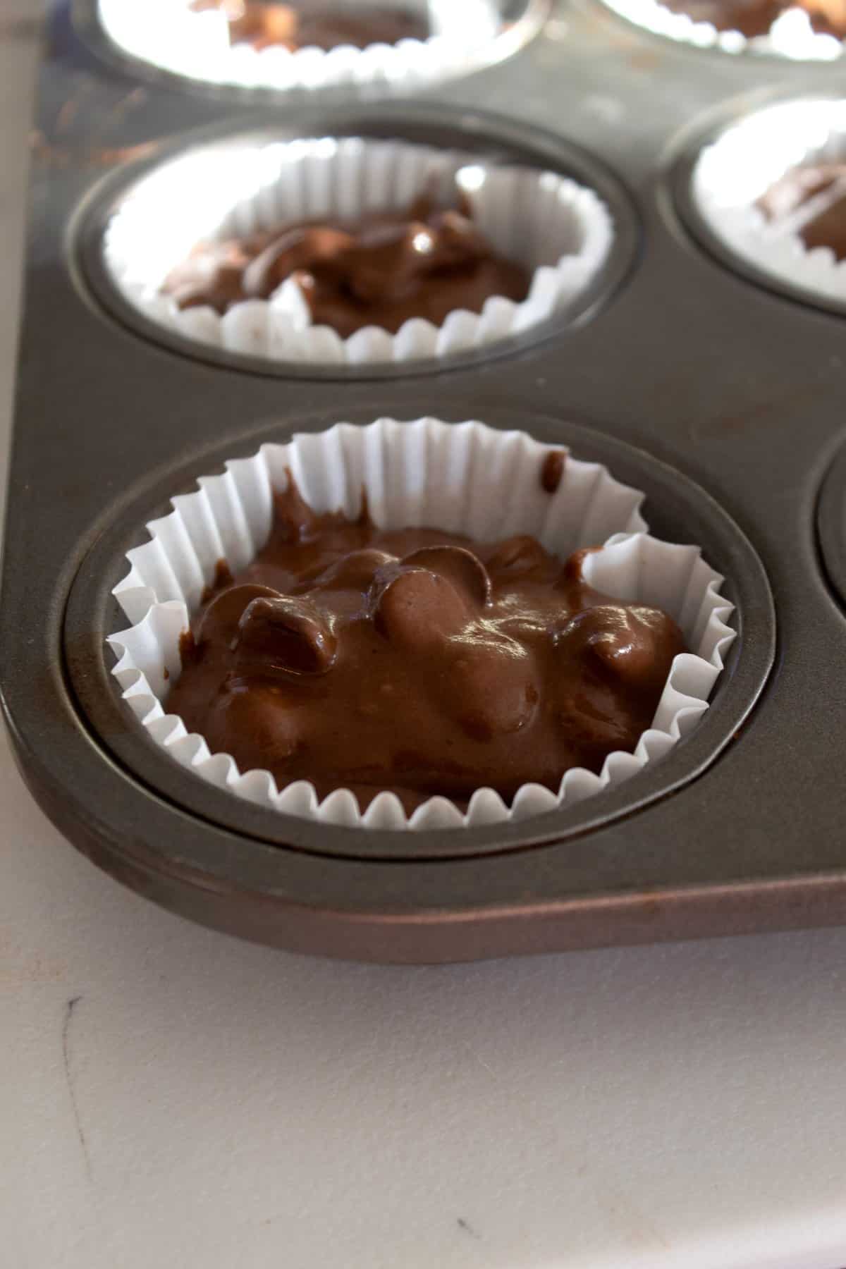 cupcake brownie batter in a muffin tin