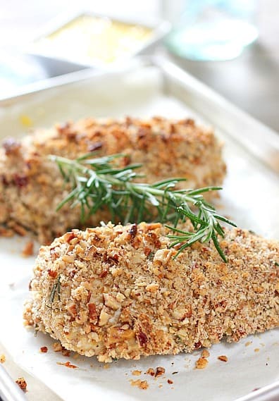 Chicken ready to serve with a sprig of rosemary