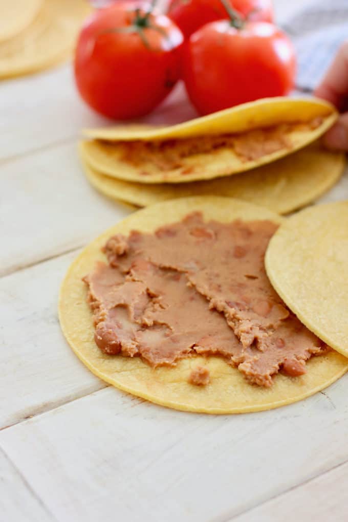 refried beans on a tortilla