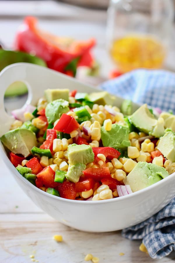 Fresh corn salad in a white bowl