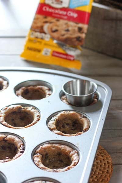 Pressing cookies into tin