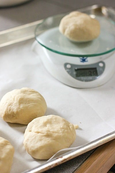 weighing the dinner rolls for perfect baking