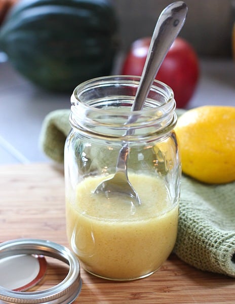 Apple Cider Vinaigrette in a mason jar with spoon