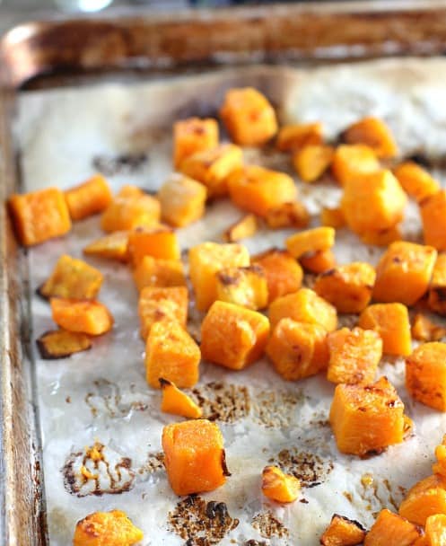 Roasted sweet potatoes on a sheet pan