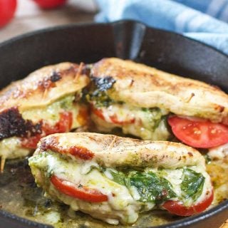 pesto mozzarella stuffed chicken in a pan