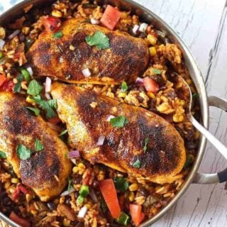 chicken and rice in a silver skillet