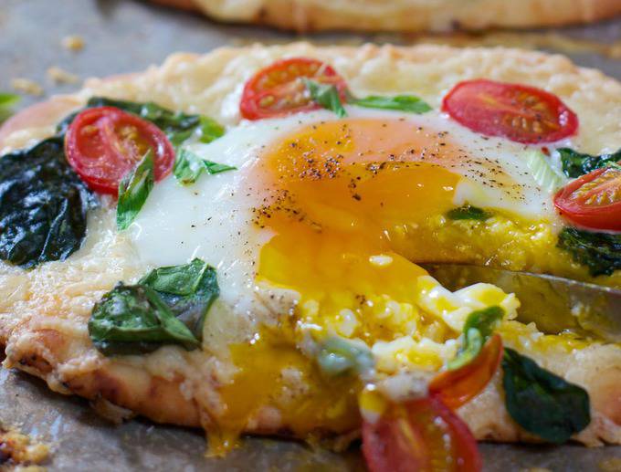 runny egg yolk on a pizza
