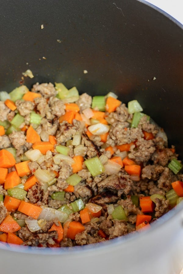 sausage carrots and onion in big pot