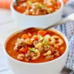 minestrone sauste soup in white bowls