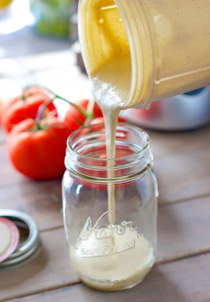 Skinny Caesar Dressing being poured from blender