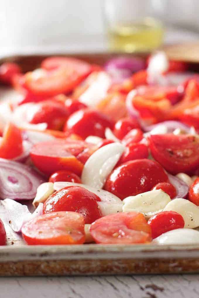 Fresh veggies ready to roast on a baking sheet