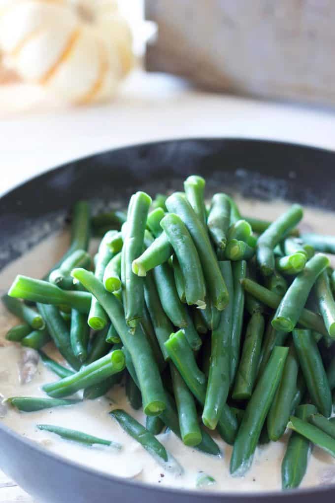 Green Beans being tossed in cream sauce