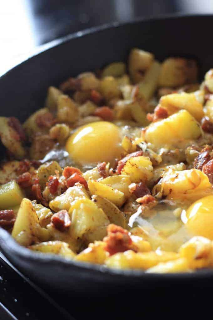 Skillet Baked Eggs with Potatoes and Bacon - Laughing Spatula