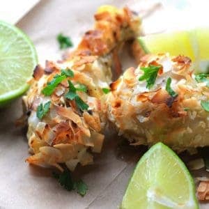 Coconut and Lime Chicken Drumsticks with lime and cilantro garnish