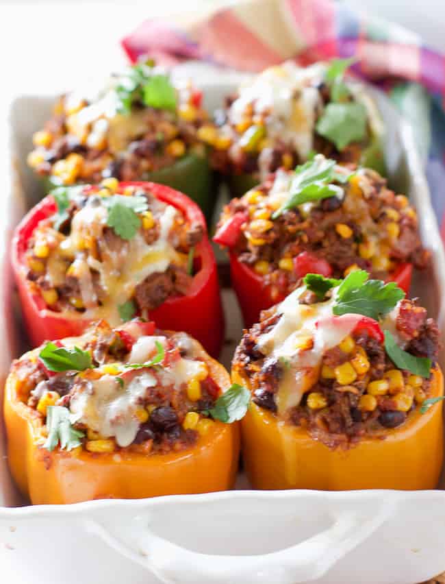 Stuffed peppers in a white casserole dish