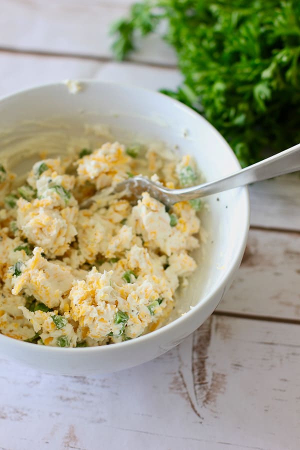 cream cheese, jalapeño and cheddar in a small bowl