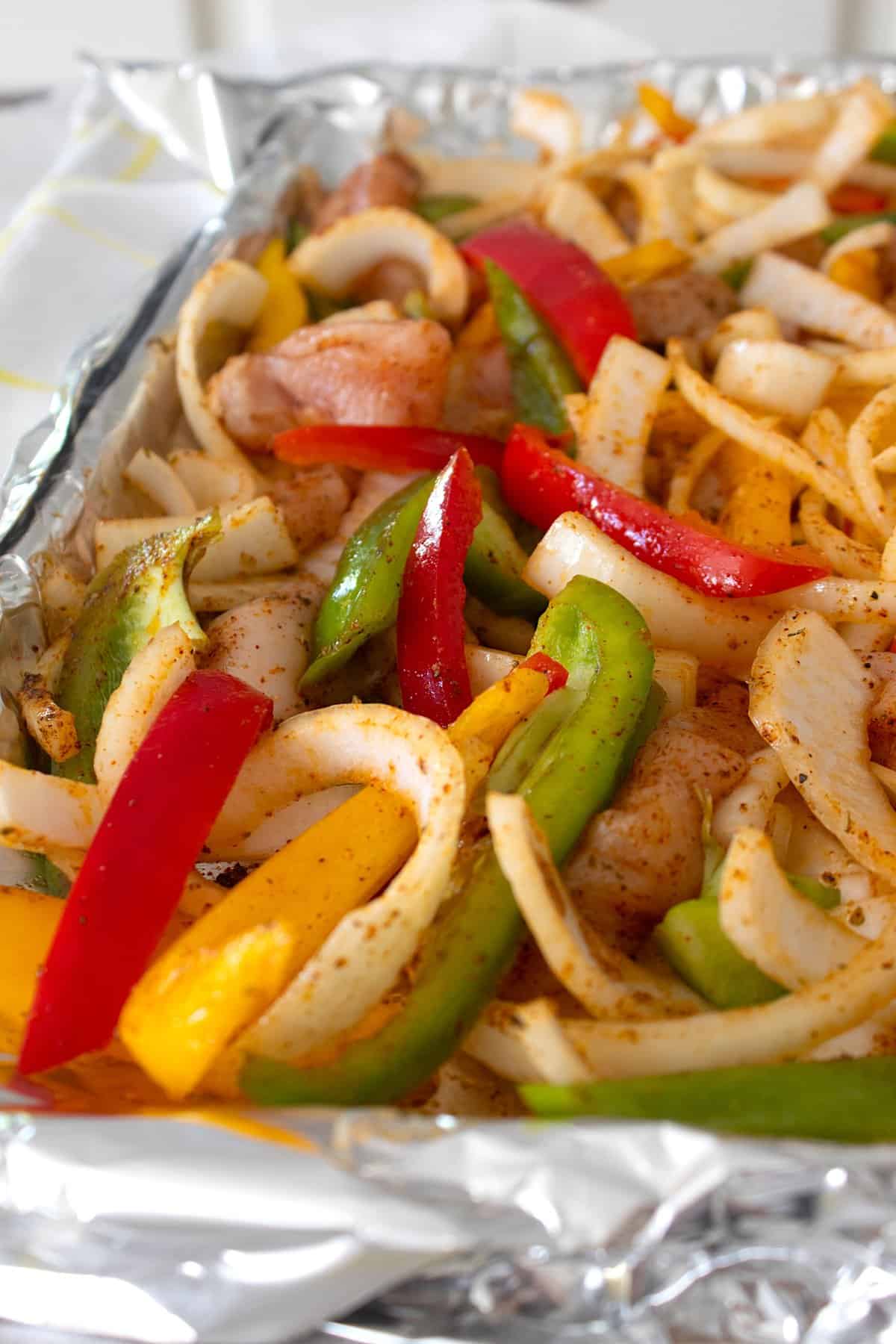 overhead shot of sheet pan fajita on a foil lined pan