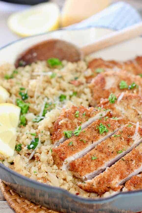 Sliced pork cutlets on top of cauliflower rice