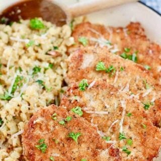 Crispy Pork Cutlets with savory cauliflower rice in a beautiful blue skillet