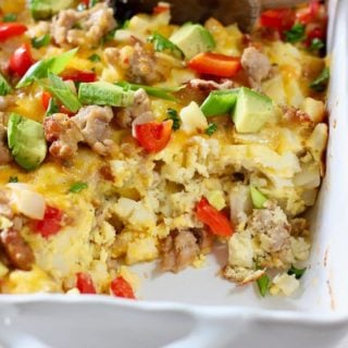 eggs, sausage and has brown casserole in white baking dish
