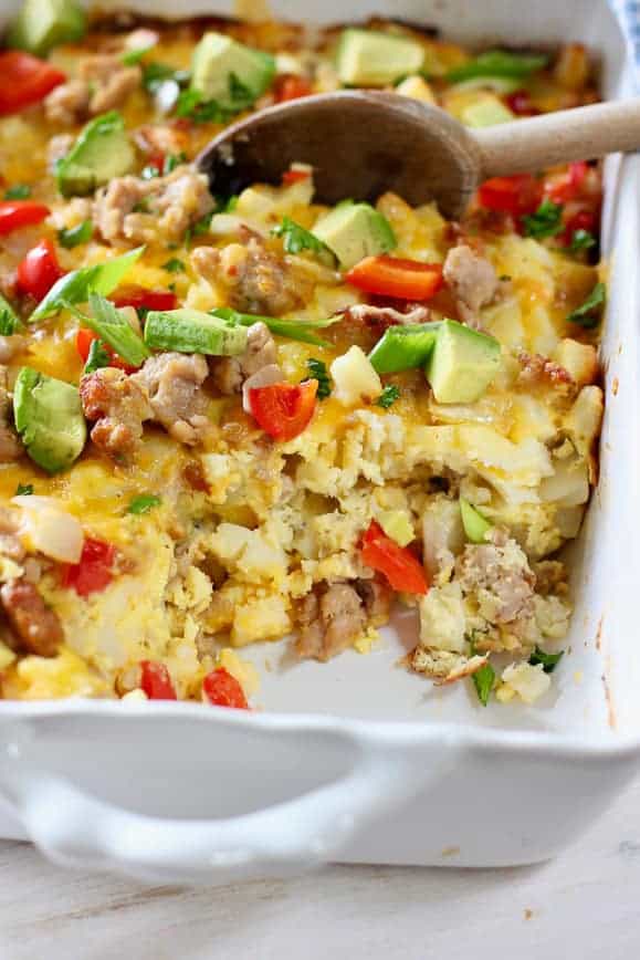 eggs, sausage and has brown casserole in white baking dish