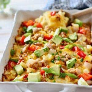 Egg and Sausage Hashbrown Casserole in a white casserole dish