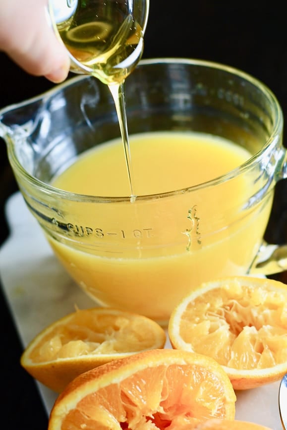 Adding honey to orange juice before freezing.