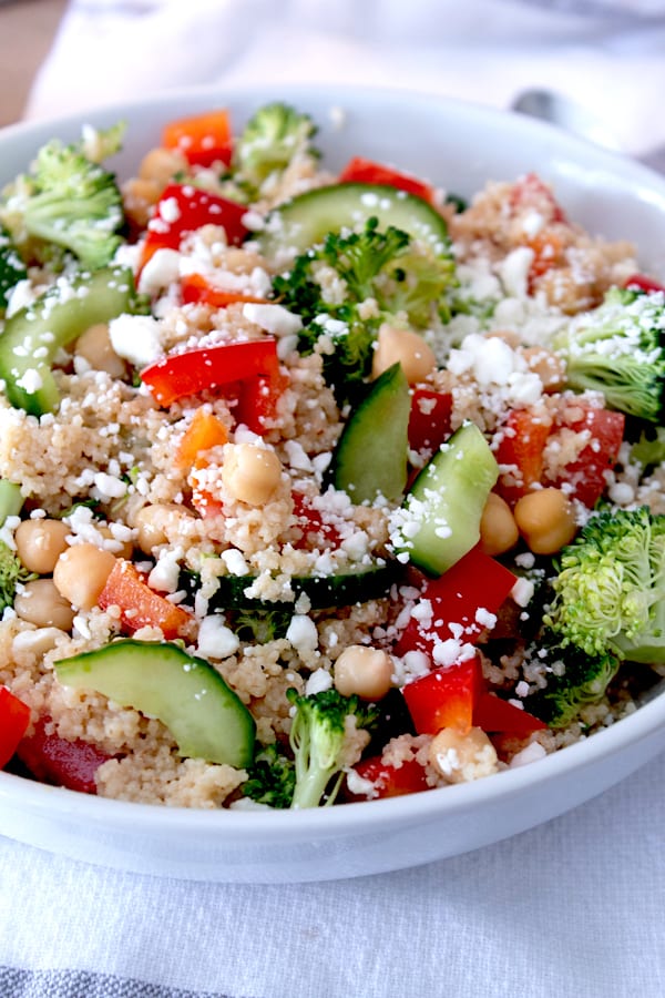 mediterranean couscous salad in a white porcelain bowl