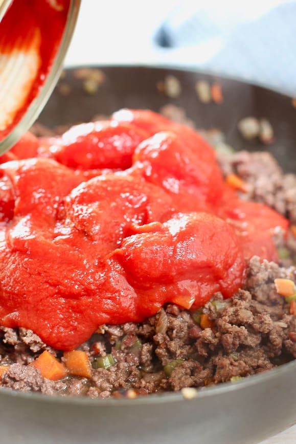 Tomatoes going into Classic Bolognese