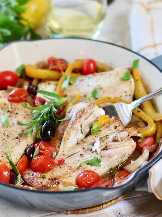 Mediterranean fish being served in blue skillet